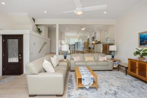 a living room with two couches and a table at Pacific Bliss - DMBC767 in Solana Beach