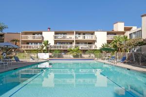 a swimming pool in front of a apartment building at Aqua Horizon - SBTC112 in Solana Beach