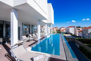an image of a swimming pool in a villa at Dedaj Resort - Villa Delux with Sea View Pool in Zadar