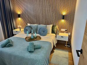 a bedroom with a bed with blue towels on it at Callao Ocean View Luxury, air condition, wifi in Callao Salvaje