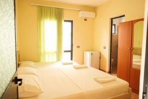 Postel nebo postele na pokoji v ubytování Haka Guesthouse