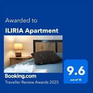 a poster for a hotel room with a bed at ILIRIA Apartment in Durrës
