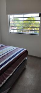 Postel nebo postele na pokoji v ubytování Departamento101