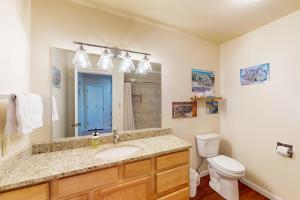 a bathroom with a sink and a toilet at Pines 4058 in Pagosa Springs +14 photos