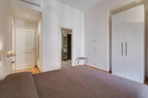 Postel nebo postele na pokoji v ubytování Vantaggio Apartment