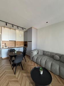 a living room with a couch and a table at The Best Shkoder in Shkodër