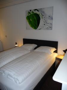 En eller flere senge i et værelse på Apartment Nieuw-Moscou
