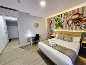 Postel nebo postele na pokoji v ubytování Feeling Home - Suites&Rooms