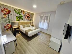 Postel nebo postele na pokoji v ubytování Feeling Home - Suites&Rooms