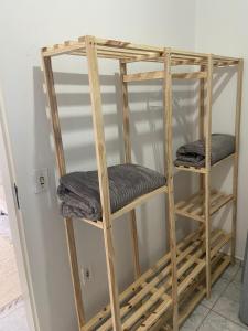 a couple of wooden bunk beds in a room at Pousada Vila do Meio in Pinheiro
