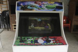 a video game cabinet with a game on it at Eco Cabana 01 in Santo André +16 photos