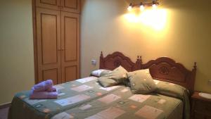 a bedroom with a bed with two stuffed animals on it at La Perxada de Besolí in Areu