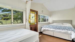 Giường trong phòng chung tại Tullenderly