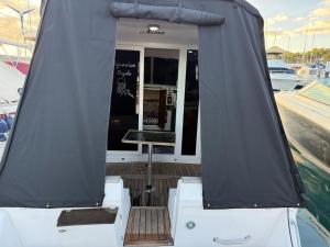 a boat with a tent on the deck at Barco Puerto Calero in Puerto Calero +4 photos