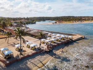 an aerial view of a resort on the beach at Chalé Sertão e Mar in Canguaretama