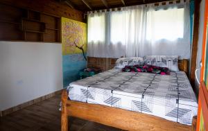 Postel nebo postele na pokoji v ubytování Reserva Natural Origen Alojamiento Campestre