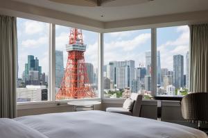a bedroom with a view of the eiffel tower at The Prince Park Tower Tokyo - Preferred Hotels & Resorts, LVX Collection in Tokyo