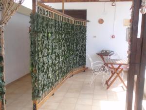 a living room with a wall covered in ivy at Traditional Studio in Kalymnos