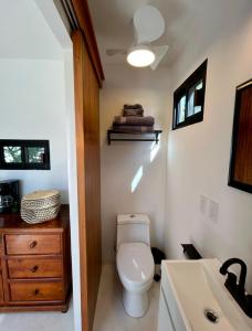 a bathroom with a toilet and a sink at Casita Palo Verde in San José del Cabo
