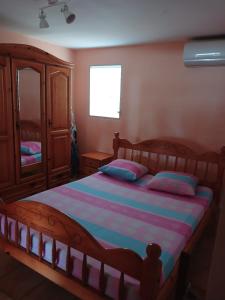 Postel nebo postele na pokoji v ubytování Villa hibiscus