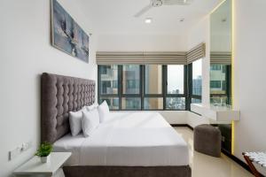 Postel nebo postele na pokoji v ubytování La Privé Apartments TRI-ZEN + 30 fotografií