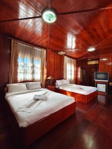 Katil atau katil-katil dalam bilik di Nakai Resort