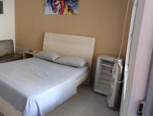 Postel nebo postele na pokoji v ubytování Hotel Zenit de colombia