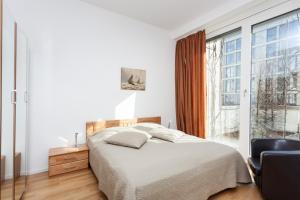 Кровать или кровати в номере Modern Apartment in the Luxury Complex Marthashof
