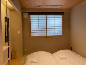 Postel nebo postele na pokoji v ubytování Hotel Fukudaya