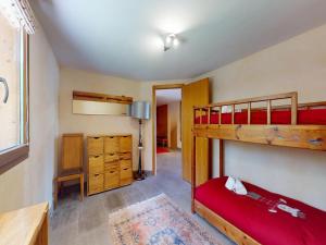 a bedroom with two bunk beds and a desk at Majestic chalet with indoor pool in Nendaz +22 photos