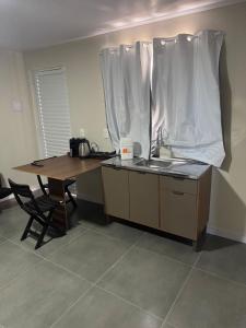 Flats & Residences - Apart Moderno com Conforto的厨房或小厨房