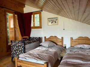 a bedroom with two beds in a room at Pet-friendly chalet in Veysonnaz in Veysonnaz