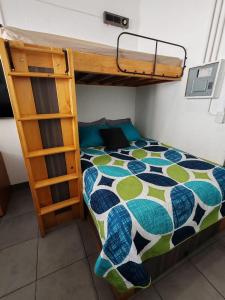 a bed in a room with a bunk bed at Apartamento zona 1 in Guatemala