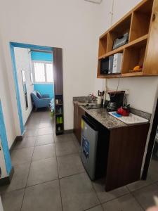 a kitchen with a sink and a counter top at Apartamento zona 1 in Guatemala +5 photos