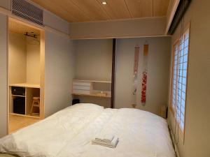 Postel nebo postele na pokoji v ubytování Hotel Fukudaya