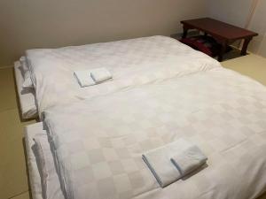 Postel nebo postele na pokoji v ubytování Hotel Fukudaya