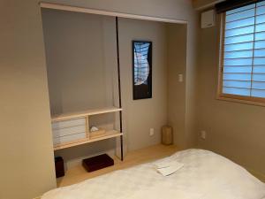 Postel nebo postele na pokoji v ubytování Hotel Fukudaya