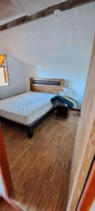 Postel nebo postele na pokoji v ubytování Casa el arenal-Lago Ranco