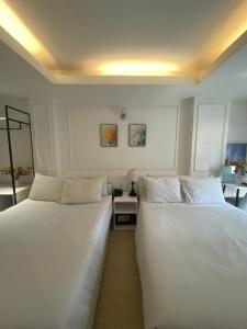 Postel nebo postele na pokoji v ubytování TwoLand Hotels & Spa