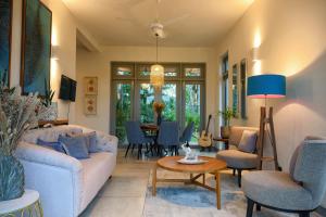 a living room with a couch and a table at TRES Galle in Galle