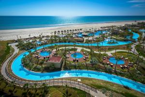 an aerial view of a resort near the beach at Encanto Living 1104 by Kivoya in Puerto Peñasco