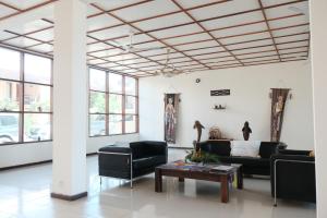 Uma área de estar em Arbiru Beach Resort