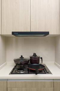 Kuchyň nebo kuchyňský kout v ubytování La Privé Apartments TRI-ZEN