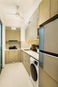 Kuchyň nebo kuchyňský kout v ubytování La Privé Apartments TRI-ZEN