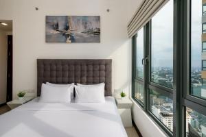Postel nebo postele na pokoji v ubytování La Privé Apartments TRI-ZEN