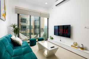 TV a/nebo společenská místnost v ubytování La Privé Apartments TRI-ZEN