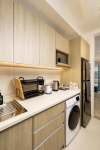 Kuchyň nebo kuchyňský kout v ubytování La Privé Apartments TRI-ZEN