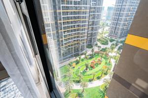 a view of a park from a window in a building at Linh Chi Homestay in Long Bình