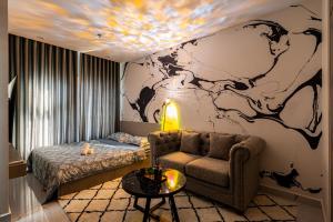 a room with a couch and a map on the wall at Linh Chi Homestay in Long Bình