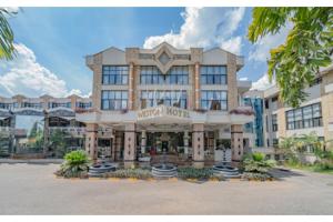 a hotel exterior with a large building at Weston Hotel in Nairobi